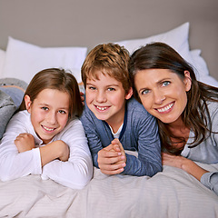 Image showing Portrait, bed and mother with children, family and single parent with smile and bonding together. Face, siblings and home with mama and bedroom with kids and cheerful with fun and playing with joy