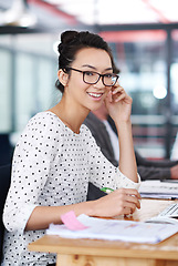 Image showing Happy, portrait and creative woman at desk in office planning with notes for project or report. Professional, employee and person with a smile for productivity, process or work on development of idea