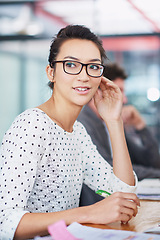 Image showing Happy, thinking and creative woman at desk in office planning with notes for project or report. Professional, employee and person with a smile for productivity, process or work on development of idea