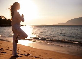 Image showing Sunset, beach or woman with meditation in nature for peace, zen or mental health wellness. Spiritual, balance or female person at the ocean for energy, breathing or holistic self care at sea sunrise