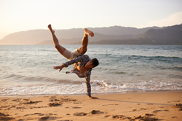 Image showing Man, dancer and breakdance with sand on beach for hip hop performance, workout training or portrait. Ocean, dancing and movement with energy by horizon, stunt or flexible talent on Maldives holiday