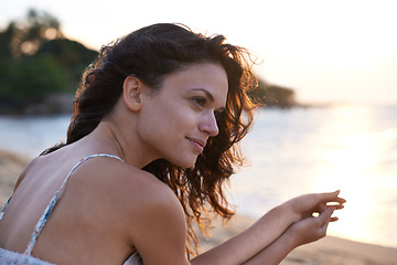 Image showing Woman, thinking with ocean view on beach and travel for wellness, fresh air and sunset on holiday in Bali. Reflection, memory and future with summer vacation for tourism, mindfulness and adventure