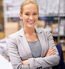 Image showing Happy woman, portrait and manager with confidence at warehouse for storage, inventory or management. Confident female person or employee with smile and arms crossed for distribution or supply chain