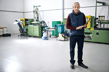 Image showing Man, confident and manager of warehouse with clipboard for stock taking in manufacturing, distribution and package for supplier. Portrait, mature and logistics in factory with machines and storehouse