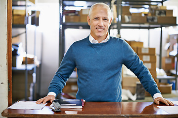 Image showing Man, portrait and logistics in warehouse with smile for manufacturing at counter for supply chain, shipping and management. Male person, factory and boss for commercial distribution of cargo in plant