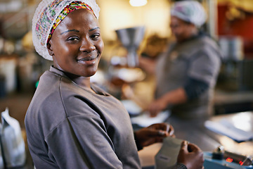 Image showing Woman, portrait and factory or packaging product in as warehouse worker or shipping, manufacturing or distribution. Female person, face and hair net at supply chain facility, supplier or wholesale