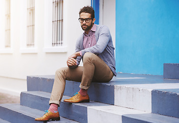 Image showing Man, fashion and relax in city with glasses, frame for style and confident in chic outfit. Urban, unique and trendy designer clothes, spectacles for accessory and apparel with model thinking outdoor