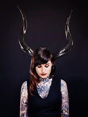 Image showing Woman, horns and tattoo for costume, cosplay and creative with ink for design, picture and symbol. Young person and ears for art and bold for statement, funky and edgy or unique on dark background