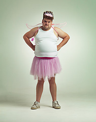 Image showing Fairy, costume and portrait of man in studio with magic, wand and wings on angry plus size model. Cosplay, character and dress up for role play on white background, mockup and space for fantasy