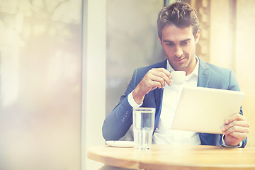 Image showing Glass, tablet and businessman at coffee shop, cafe and restaurant for break, espresso and tea to relax from work. Male person, table and technology for communication, email and internet for digital