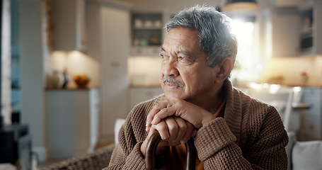 Image showing Thinking, depression and senior man with walking stick on chair with Alzheimer, memory loss or lonely. Face, anxiety and elderly male with a disability and mobility cane in living room sad or stress