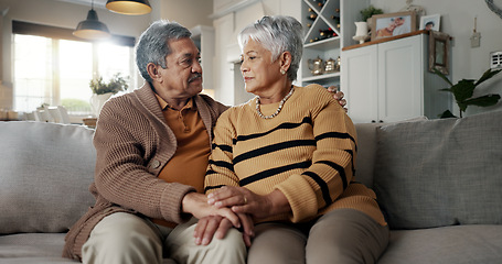 Image showing Senior, couple and hug for empathy on sofa with support, grief and comfort in living room of house. Old people, man and woman with love and embrace for security, compassion and sympathy on couch