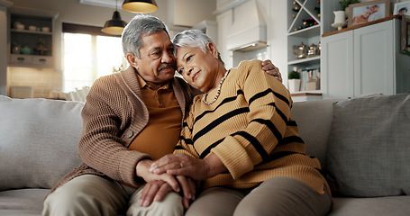 Image showing Senior, couple and hug for empathy on sofa with support, grief and comfort in living room of house. Old people, man and woman with love and embrace for security, compassion and sympathy on couch