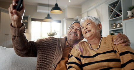 Image showing Senior couple, selfie and smile on sofa, hug and bonding with love, support and relax in retirement in home. Elderly woman, old man and happy with profile profile, web blog and social media on couch