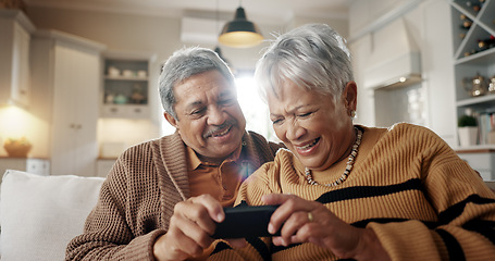 Image showing Senior couple, selfie and smile on couch, hug and bonding with love, check post and relax in retirement in home. Elderly woman, man and laugh with profile profile, web blog and social media on sofa