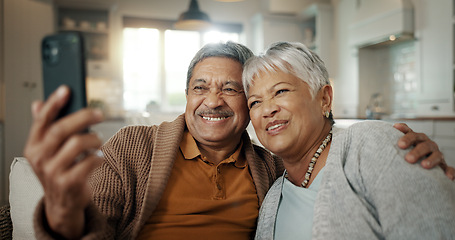 Image showing Senior couple, video call and wave on sofa, smile and hug with love, phone and relax in retirement in home. Elderly woman, old man and webinar with chat, together and talking on living room couch