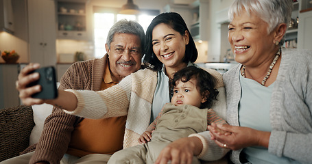 Image showing Selfie, woman and senior parents with baby bonding together on a sofa for relaxing at home. Happy, smile and female person taking a picture with elderly people and child in retirement in the lounge.