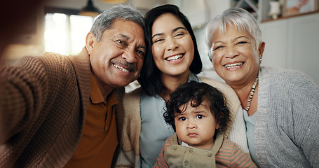 Image showing Happy family, love and selfie in a living room relax, bond and laughing in their home. Portrait, smile and baby with mother and grandparents in a lounge together for profile picture, moment or memory