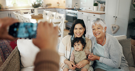 Image showing Phone screen, hands and picture of family in living room with smile, kids and grandparent on sofa. Social media, photo and mother with a baby and grandmother happy in a home together with love