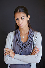 Image showing Portrait, serious and business with woman, arms crossed and professional on a dark studio background. Face, creative entrepreneur or consultant with startup and company owner with confidence or agent