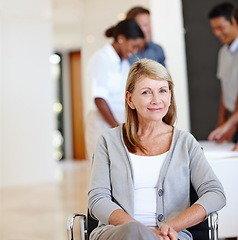 Image showing Portrait, business person and woman in a wheelchair, startup and professional in a modern office. Lady with a disability or senior employee with workplace accessibility or inclusion with consultant