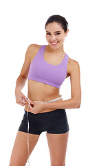 Image showing Portrait, fitness and woman with measuring tape for waist, weight goal with diet and exercise on white background. Health, body and wellness, check progress for weightloss and measurement in studio