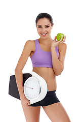 Image showing Portrait, scale and woman with wellness, apple and healthy person isolated on a white studio background. Face, happy girl and model with smile and exercise with diet plan and weight loss with fruit