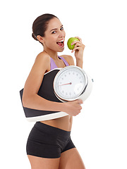 Image showing Portrait, scale and woman with benefits, apple and healthy person isolated on a white studio background. Face, happy girl and model with wellness and balance with diet plan and weight loss with smile