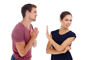 Image showing Divorce, fight and couple in studio with sorry hands for cheating, liar or mistake on white background. Marriage, conflict and people argue with stop palm for frustrated woman with rejection sign