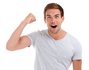 Image showing Winner, fist pump and portrait of man on a white background for winning, good news and success. Confidence, excited and face of isolated person with flex for bonus, celebration and surprise in studio