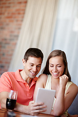 Image showing Couple, relax and smile in home with tablet for streaming online for movies or films, videos and social media memes. Man, woman and together with hug for bonding or love with affection and support.