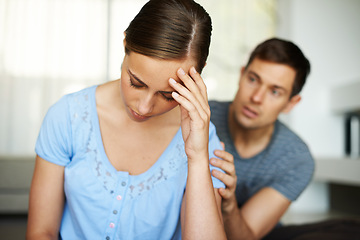 Image showing Couple, stress and fight in home with argument or angry with apology and sad in disappointment. Relationship, confrontation and marriage issues in living room on couch with conflict and emotions.