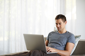 Image showing Relax, remote work and man on sofa with laptop for working from home, freelance job and career. Business, startup and person on computer for typing email, planning or internet research on website