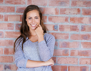 Image showing Brick wall, leaning and portrait of woman with smile for scholarship to university in USA. Background, student and female person with happiness in campus of academy, gen z and girl back to school