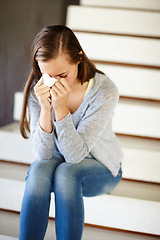 Image showing Stress, crying or woman in house with tissue, depression or mental health, crisis or disaster. Stairs, vertigo or sad person with tears, anxiety or overwhelmed fail, mistake or ptsd, memory or trauma