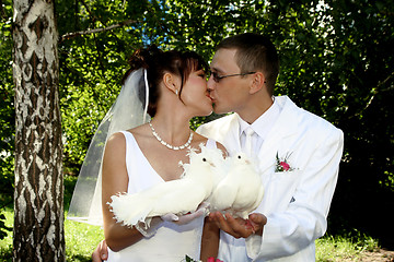 Image showing Groom and bride kiss