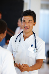 Image showing Asian doctor, portrait and discussion with report, results and paperwork for health and wellness. Cardiologist, stethoscope and medical chart for healthcare, insurance and professional diagnosis