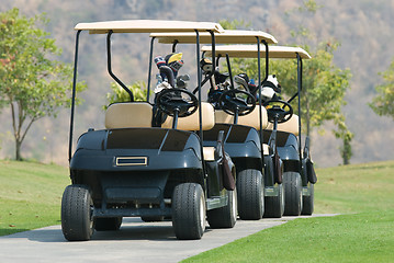 Image showing Three golf cars