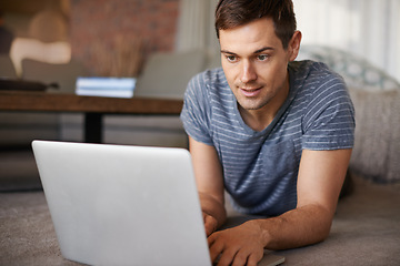 Image showing House, remote work and man on floor with laptop for working from home, freelance job and career. Business, startup and person on computer for typing email, planning or internet research on website