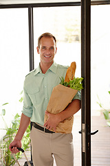 Image showing Smile, man with groceries bag in portrait with suitcase for work trip or holiday or vacation in California. Happy person, vegetables and bread as food for breakfast, lunch or dinner in apartment