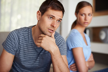 Image showing Couple, disappointed and fight in home on sofa with stress or angry and sad with marriage issues. Relationship, confrontation and argument in living room on couch with conflict and emotional