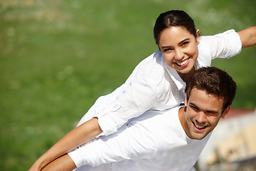 Image showing Airplane, piggyback or happy couple in a park for portrait or love with support, loyalty or smile in outdoor freedom. Grass mockup space, romantic man or woman on holiday to relax for wellness or fun