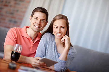 Image showing Couple, portrait and relax in home with tablet for streaming online for movies or films, videos and social media memes. Man, woman and together with hug for bonding or love with affection and support