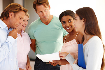 Image showing Group, discussion and happy with documents in office for creative startup, teamwork and feedback for staff. Men, woman and business people with smile in professional workplace for planning review