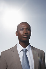 Image showing Business man, outdoor and sky with thinking, vision and ideas for career, growth and development. African corporate lawyer, attorney or employee with suit in summer, sunshine and decision in Atlanta