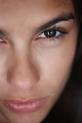 Image showing Woman, beauty and closeup face in studio, skincare and cosmetology for natural female person with brown eyes. Clean skin, serious expression with healthy glow for wellness, determination and eyebrows