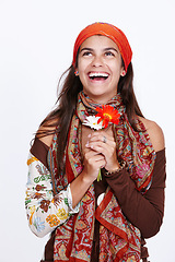 Image showing Gypsy, fashion and woman with clothes for creativity and bohemian style for trend on white background. Lady, model and flower for excited with scarf for pattern and colour with headband for aesthetic