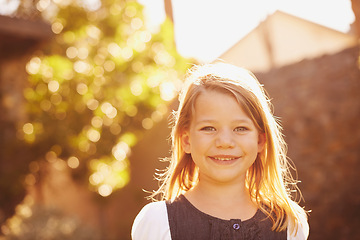 Image showing Portrait, girl or happy kid outdoor at backyard in nature or cute student alone at park with bokeh. Face, smile or adorable young child in garden on summer vacation or holiday with sunshine in Sweden