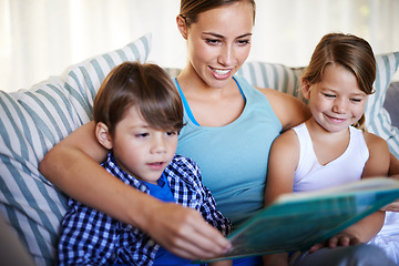 Image showing Mother, children and reading on sofa with book for fantasy story and learning for english literature or language skills for development. Family, relax and happy on couch in home with love and bonding