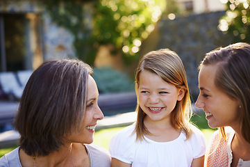 Image showing Mom, grandmother and happy child with generations at family house with embrace, bonding and love with care in garden. Grandma, people and smile with kid in outdoors on vacation with nature for memory